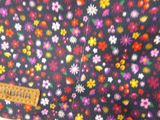 a close up of a bag with a flower pattern on it