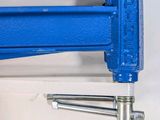 a close up of a blue clamp with a screw on it