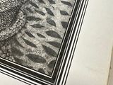 a black and white drawing of a fish on a book