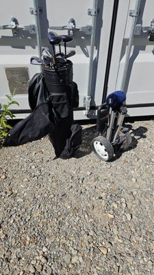 a bag of golf clubs next to a bag of golf clubs