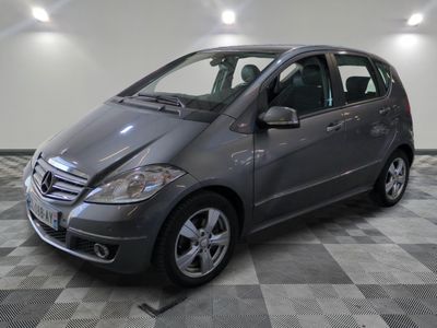 a picture of a mercedes b - class parked in a garage