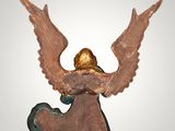 an image of a statue of an angel with wings on it ' s head