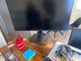 an image of a computer desk with a monitor and keyboard