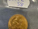 a close up of a gold coin with a label on it