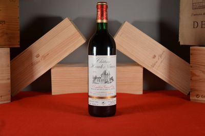 a bottle of wine that is sitting on a table