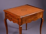 an image of a small wooden table with a drawer on it