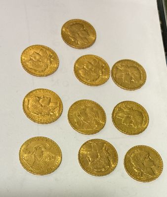 a close up of a bunch of gold coins on a table