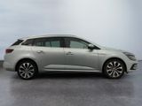 a picture of a silver car parked in a parking lot