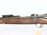 an old rifle with a wooden barrel and a metal handle