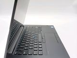 a black laptop with a blue keyboard on a white surface