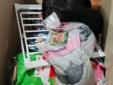 a pile of garbage in a cardboard box with a window
