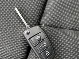 a car key sitting on the back seat of a car