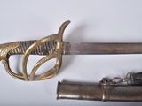 two swords that are laying next to each other on a table