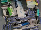 a lot of electronics in a plastic box on the floor