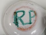 a close up of a pitcher with the word r p painted on it