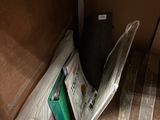 a pile of newspapers and other items on the floor