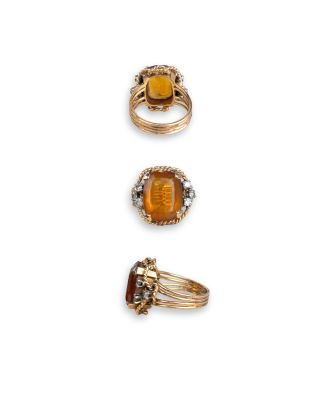 three rings and a ring on a white surface with a white background