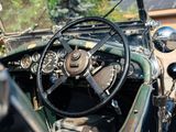 a close up of a steering wheel and dashboard of a car