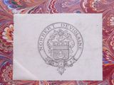 a close up of a piece of paper with a coat of arms on it