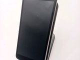 a cell phone that is sitting on top of a stand