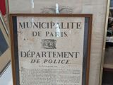 a picture of a framed sign on display in a museum