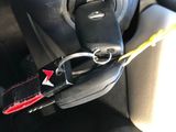 a car dashboard with a key chain attached to it