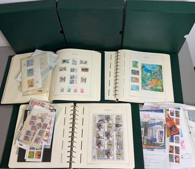 a lot of stamps in a green box on the table