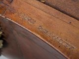 an old wooden box with a handle and a handle on top of it