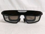 an image of a pair of black sunglasses with a clear lens