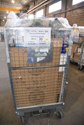 a metal cart with a sign on it in a warehouse