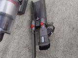 two vacuums that are on the ground next to each other