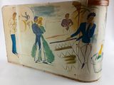 a suitcase with a painting on it sitting on a table