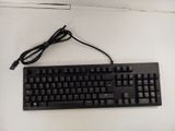 a black keyboard with a cord attached to it
