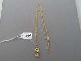 gold plated necklace with a lock and a chain with a price tag
