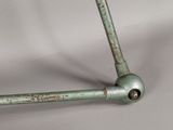 a close up of a metal pipe on a white surface