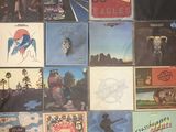 a lot of different album covers on the wall