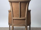 an image of a wooden chair sitting on top of a carpeted floor