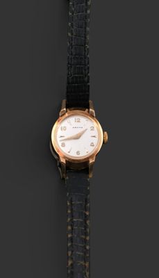 an image of a close up of a wrist watch on a black surface
