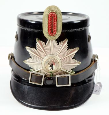 a black hat with a gold star on it