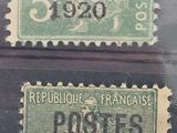 four different postages from france and france on display in a glass case