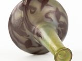 a wine bottle that is sitting on a white surface