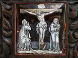 a painting of jesus on the cross with other people