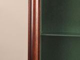 a wooden cabinet with a glass door and a clock on top of it