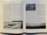 an open book with a picture of a plane on it