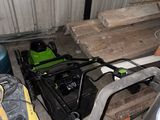 an image of a garage with tools on the floor