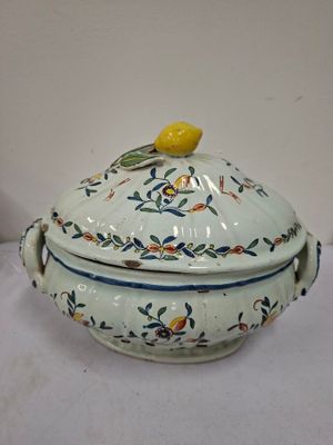an image of a tureeny dish with a lemon on top