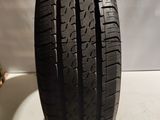 a close up of a tire on a white surface