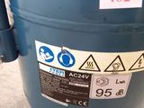 a blue tank that has a lot of stickers on it