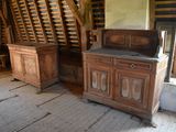 two wooden cabinets in the attic of an old house