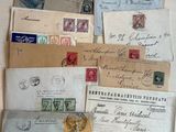 many different types of letters and envelopes laid out on a table